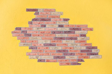 red brick wall and yellow plaster wall, bright interior