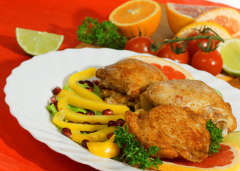 Fried chicken leg with lemon and cucumber
