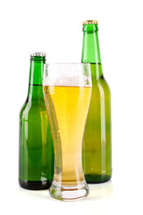 Bottle of beer and mug isolated on white