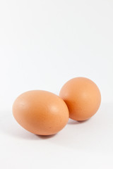 Two eggs on white background
