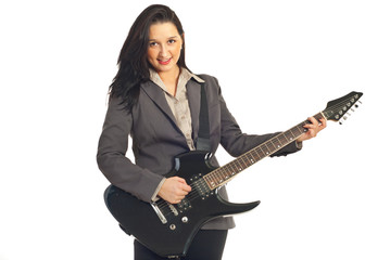 Fototapeta premium Beautiful woman playing guitar
