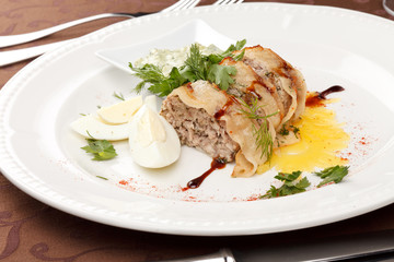 meat pie with egg and sauce