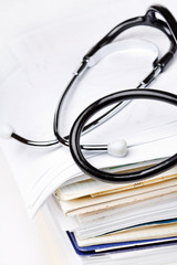 stethoscope on the stack of paper