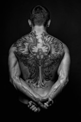 Moael with angel tattoo - obrazy, fototapety, plakaty