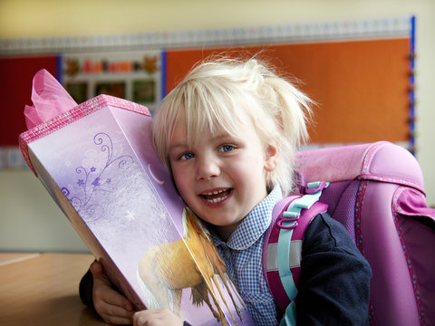 Cute blond girl has her first day at school
