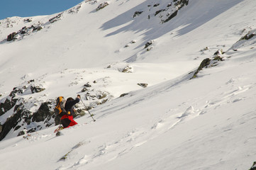 Climber reaching the summit of the Retezat mountains.Romania