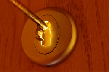 Key and light passing through a keyhole