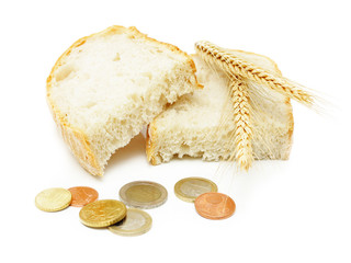 Euro coins and brad slices with grain ears