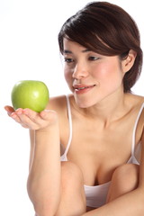 Beautiful Japanese girl holding green apple fruit