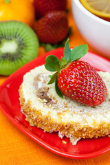 lemon,lemon tea,mandarin,kiwi,cake and strawberries lying on the