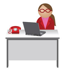 Female worker sat at her desk with telephone and laptop