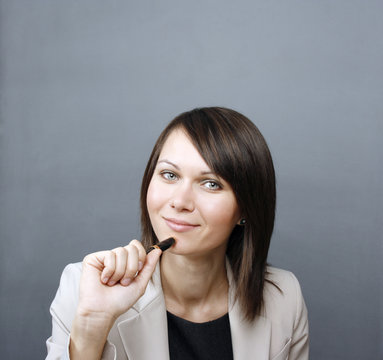 Businesswoman holding a pen