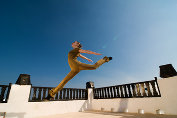 Fototapeta na wymiar Leaping yoga dancer