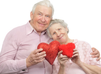 happy old couple with red hearts