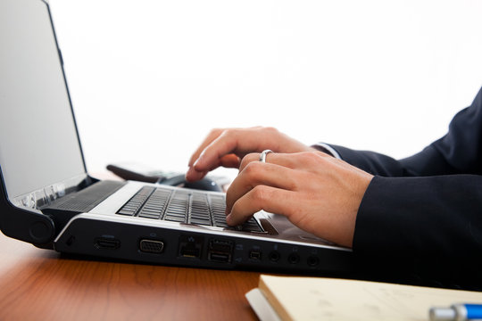 Businessman hands typing on the laptop