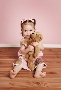 Cute Little Girl And Teddy Bear