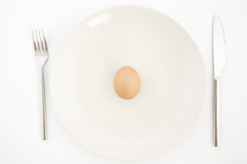 one egg on white plate