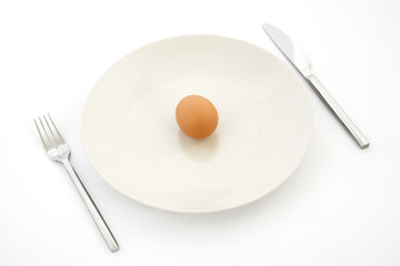 one egg on white plate