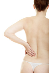 Woman massaging pain back isolated over a white background
