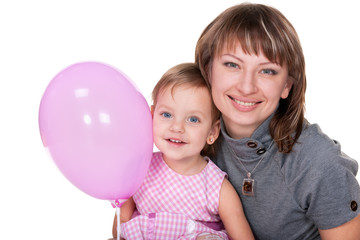 Fototapeta na wymiar Smiling girl in pink and her mom