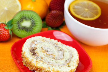 lemon,lemon tea,mandarin,kiwi,cake and strawberries lying on the