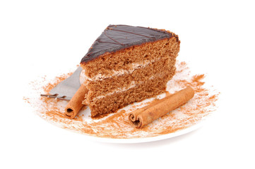 Slice of chocolate cream cake with cinnamon