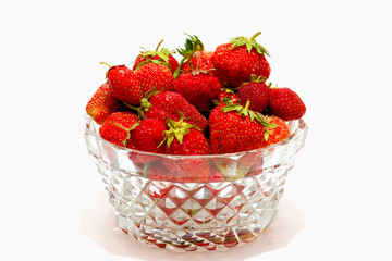 red strawberry fruits in the glass vase