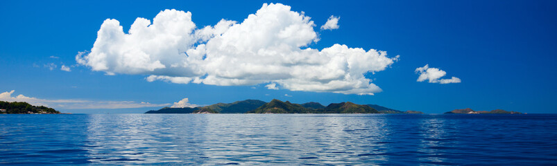 Panorama of tropical islands and big cloud