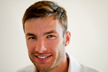 Obraz premium Portrait of a handsome businessman with light stubble.