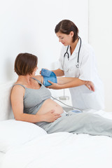 Pregnant woman with a nurse