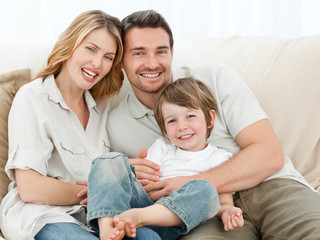 Happy family on their sofa