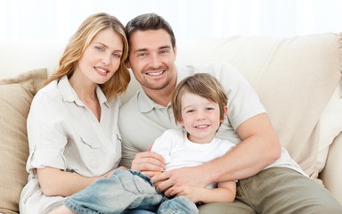 Happy family on their sofa