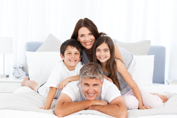 Happy familly looking at the camera