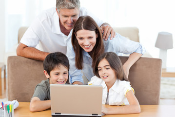 Family looking at the laptop