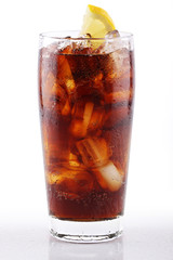 Cold cola soda drink in glass with ice cubes