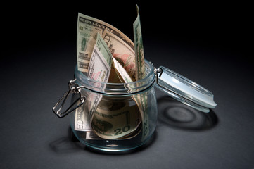 Dollars in glass jar