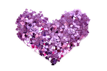 Violet hearts  in the form of confetti on white