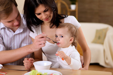 young family at home having meal