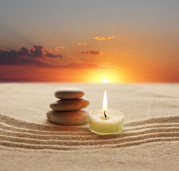 stack of stones and candle light