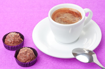 Coffee and milk chocolate sweets with hazelnut flakes