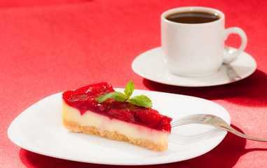 sweet strawberry piece of cake and cup of tea