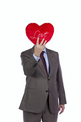 Businessman with love heart face