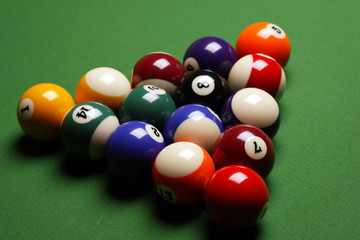 Billiard balls, cue on green table!