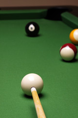 Billiard balls, cue on green table!