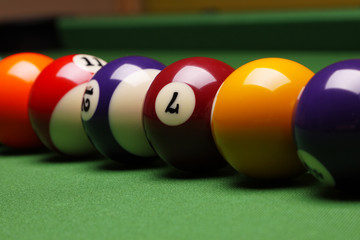 Billiard balls, cue on green table!