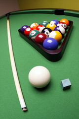 Billiard balls, cue on green table!