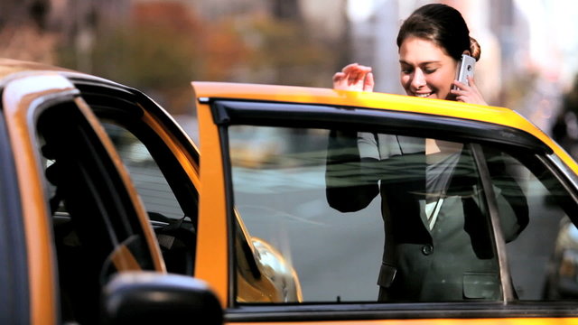 Female Getting Into Taxi with Cell Phone