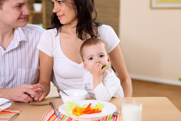 young family at home having meal