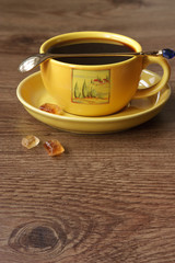 Cup of black tea with brown sugar