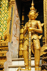 The golden giant statue in Wat Phra Kaew, Bangkok Thailand.